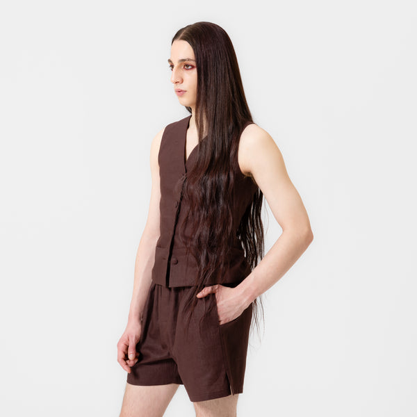 CHRIS dark brown linen vest with four covered buttons, hidden seam pockets, and adjustable back ties by Dorilou