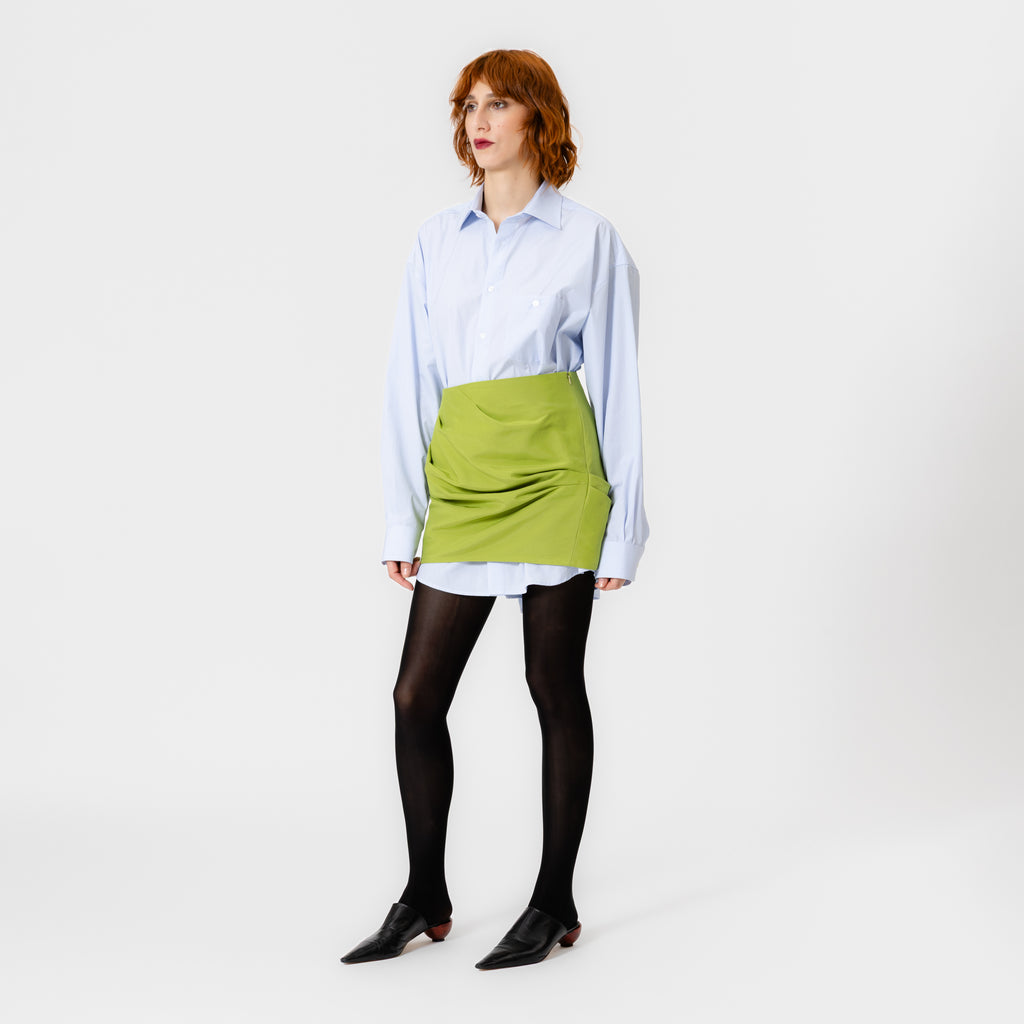 ARI lime green silk-cotton mini skirt with asymmetrical draping, high waist, and side zip by Dorilou