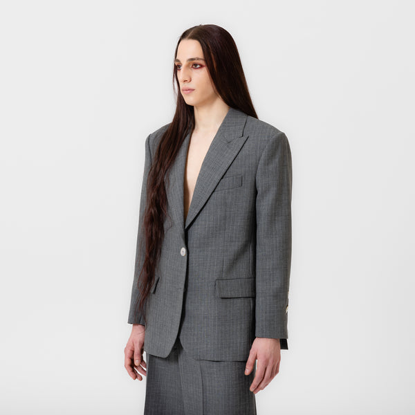 BOBBI oversized grey pinstripe suit jacket with strong shoulders, white button, and notched lapels by Dorilou
