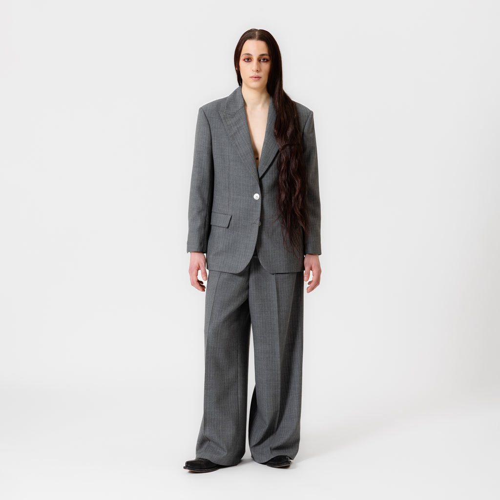 BOBBI oversized grey pinstripe suit jacket with strong shoulders, white button, and notched lapels by Dorilou