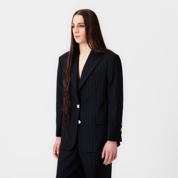 BOBBI oversized dark navy pinstripe suit jacket with strong shoulders, white button, and notched lapels by Dorilou